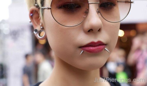 Ear And Spike Lips Face Piercing