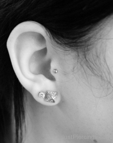 Girl Tragus and Lobe Piercing