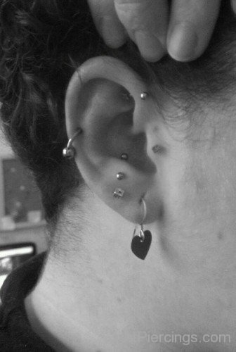 Anti Tragus Helix And Lobe Piercing