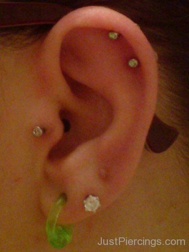 Green Lobe Tragus And Helix Piercing