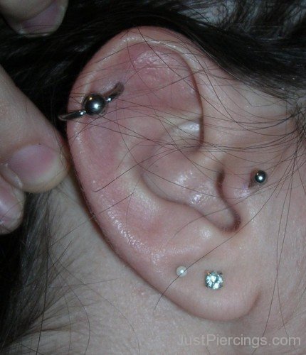 Helix Tragus And Lobe Piercing