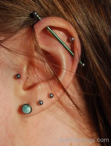 Industrial Helix Lobe And Tragus Piercing