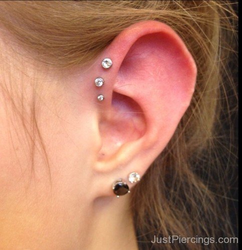 Triple Helix And Black Lobe Piercing