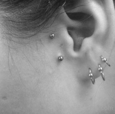 Triple Lobe And Dual Tragus Piercing