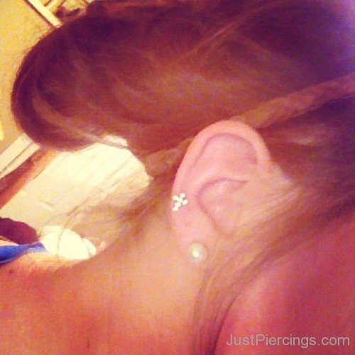 White Stud Lobe And Helix Piercing Picture