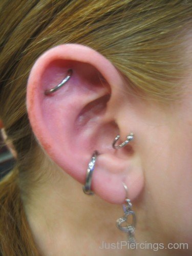 Lobe Tragus Conch And Orbital Piercing