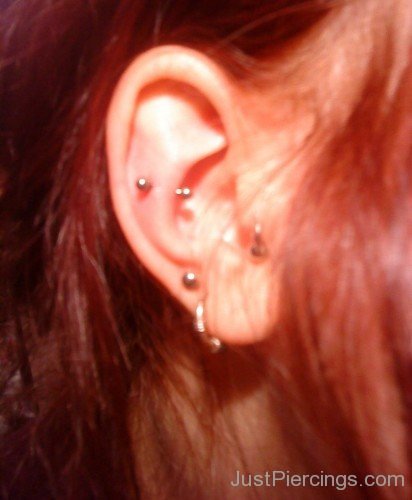 Snug Piercing And Tragus Lobe Piercing