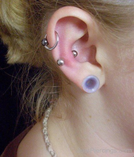 Snug Piercing With Barbell And Helix Piercing With Ball Closure Ring And Lobe Piercing