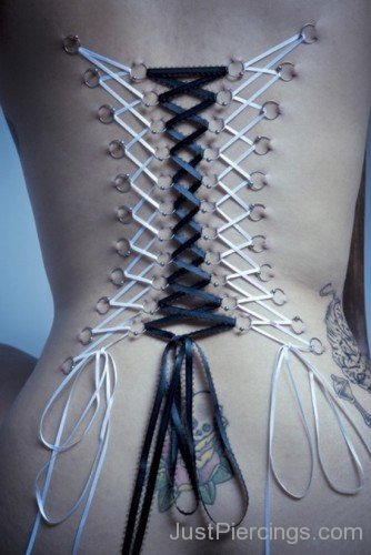 Pretty Corset Piercing