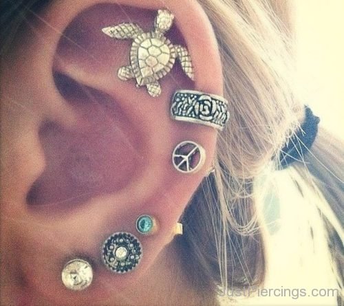 Tripple Lobe And Cartilage Piercing With Peace And Turtle Metal Studs-JP192