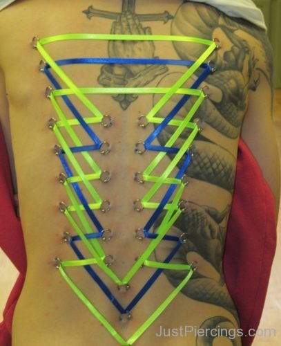 Corset Piercing And Dragon Tattoo On Back-JP1041