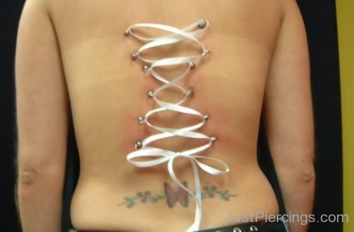 Corset Piercing And Olympic Logo Tattoo-JP1047