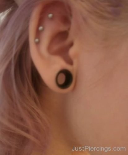 Ear Piercings With Silver Studs And Lobe Stretching-JP1237