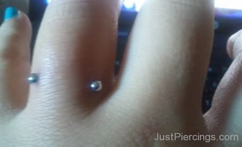 Fingers Piercing  Closeup-JP1198